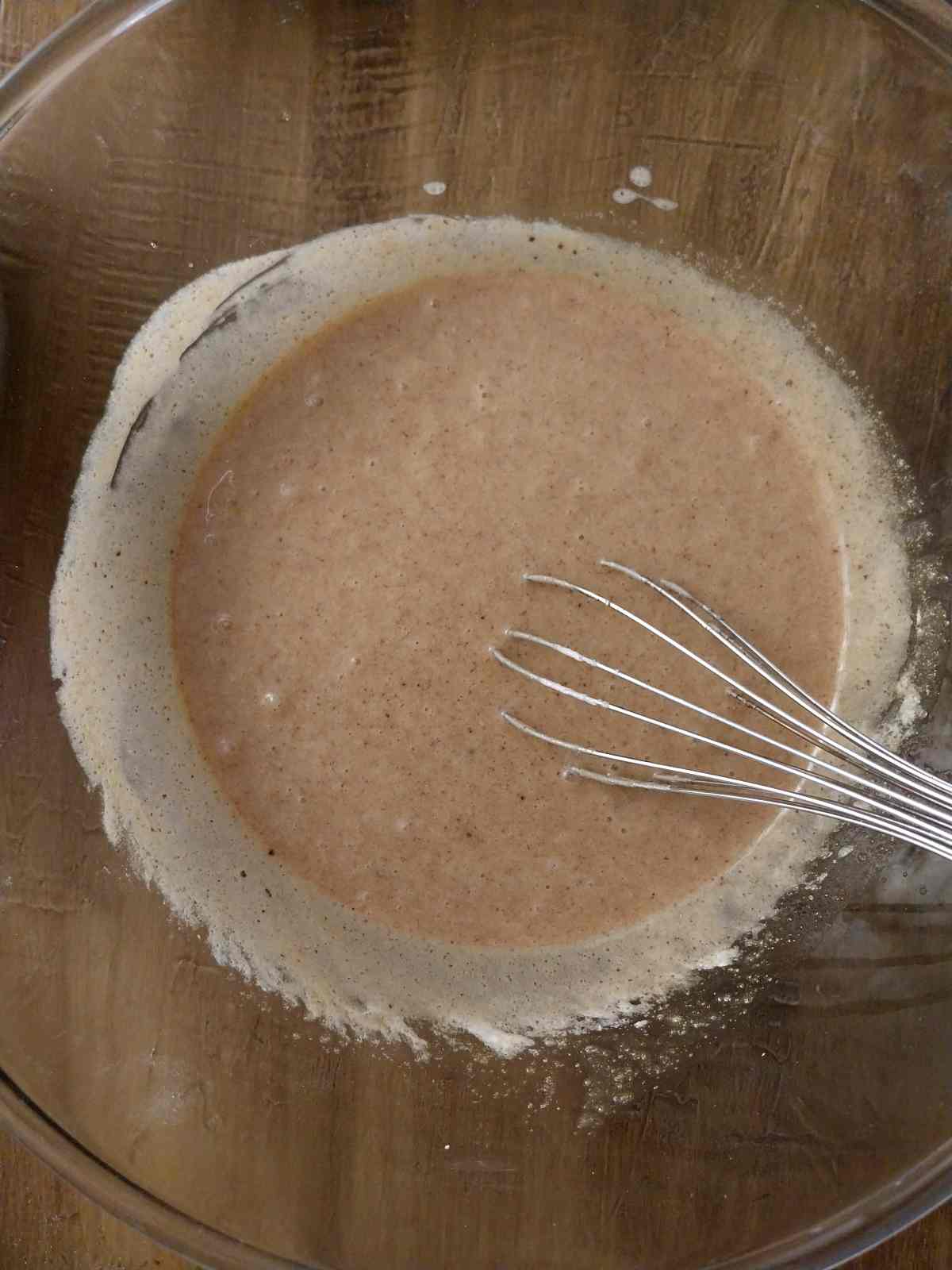 Mixing the sourdough discard into the batter.