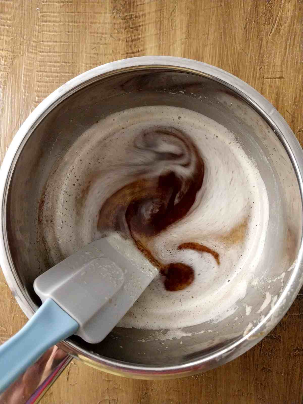 Brown butter in a saucepan with a spatula.