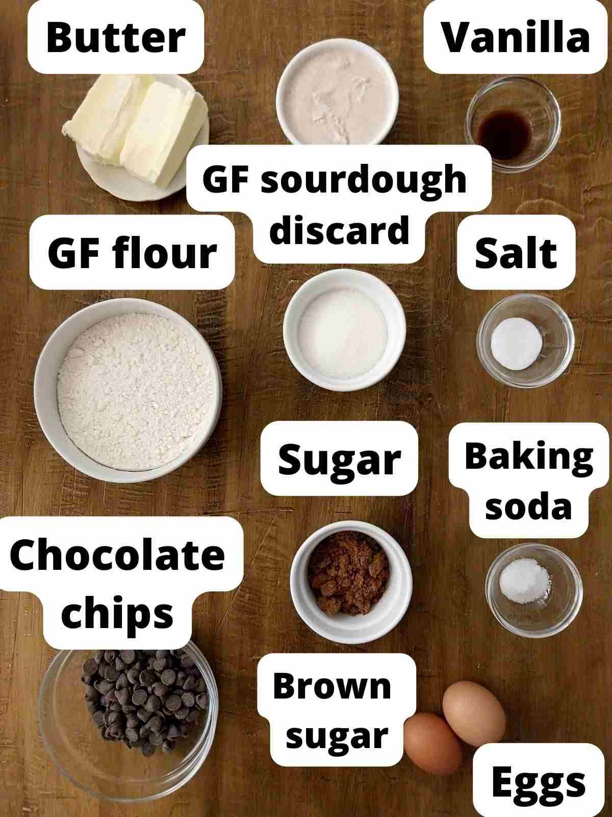 Ingredients for the cookies on a wooden surface.