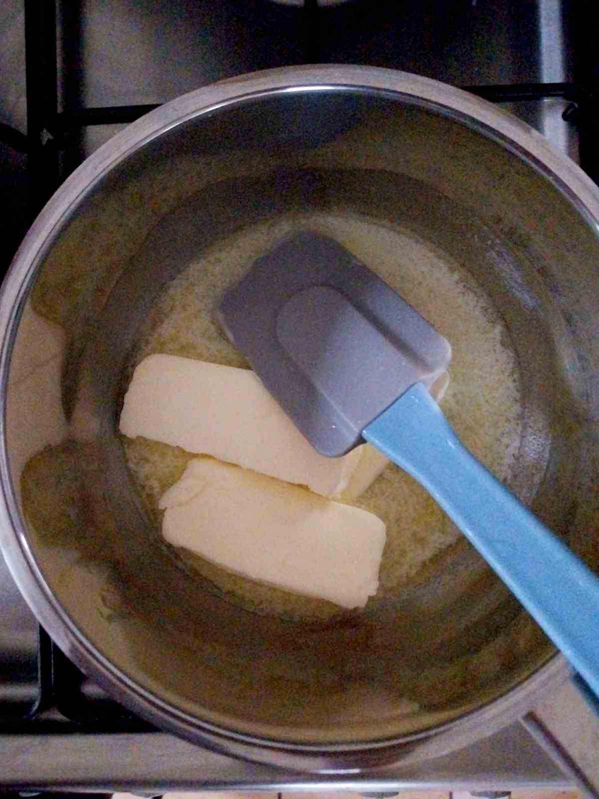 Melting butter in a small saucepan.