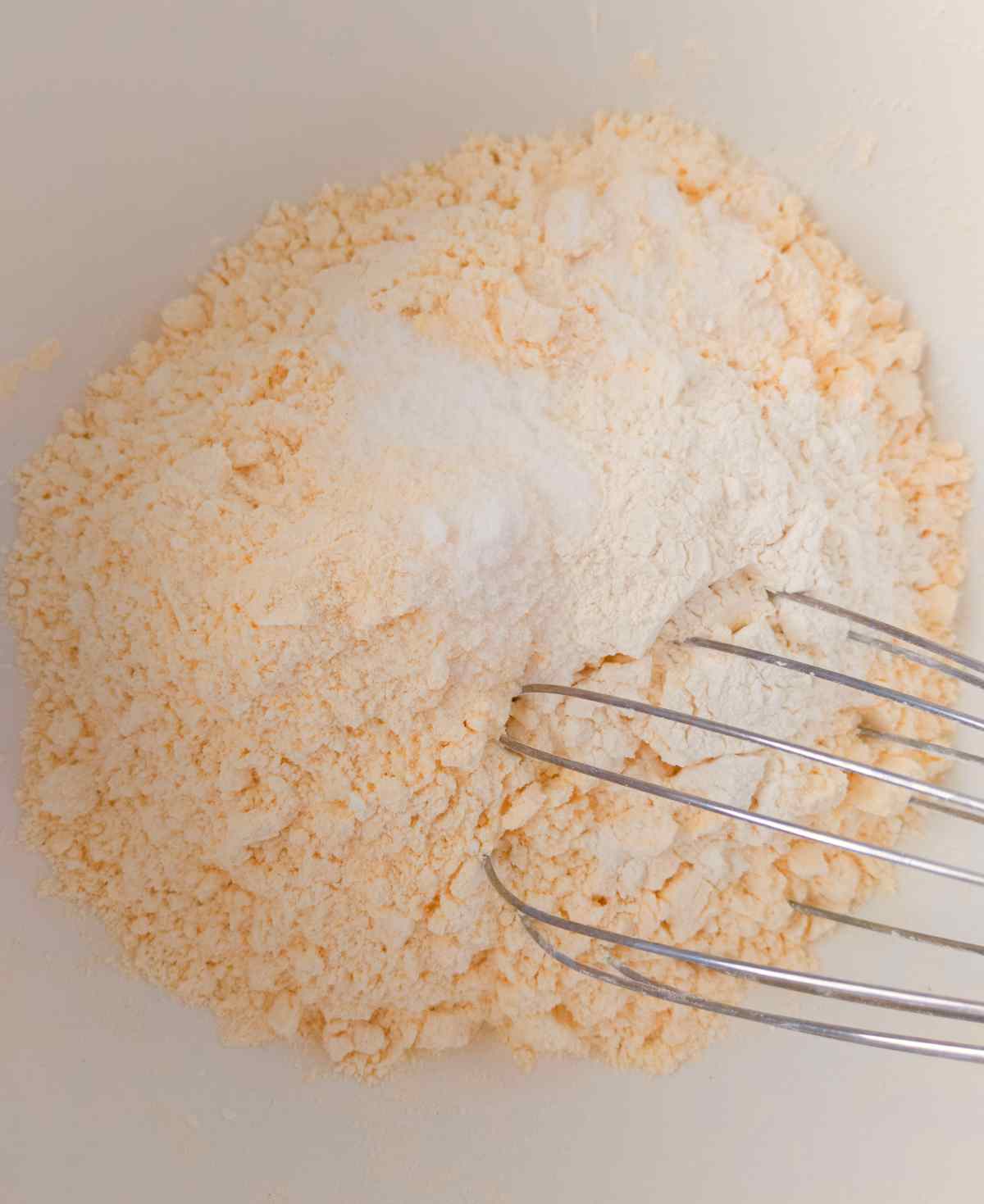 Mixing all the dry ingredients in a large mixing bowl with a whisk.