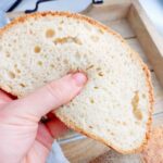 A slice of the soft and fluffy gluten-free sourdough.