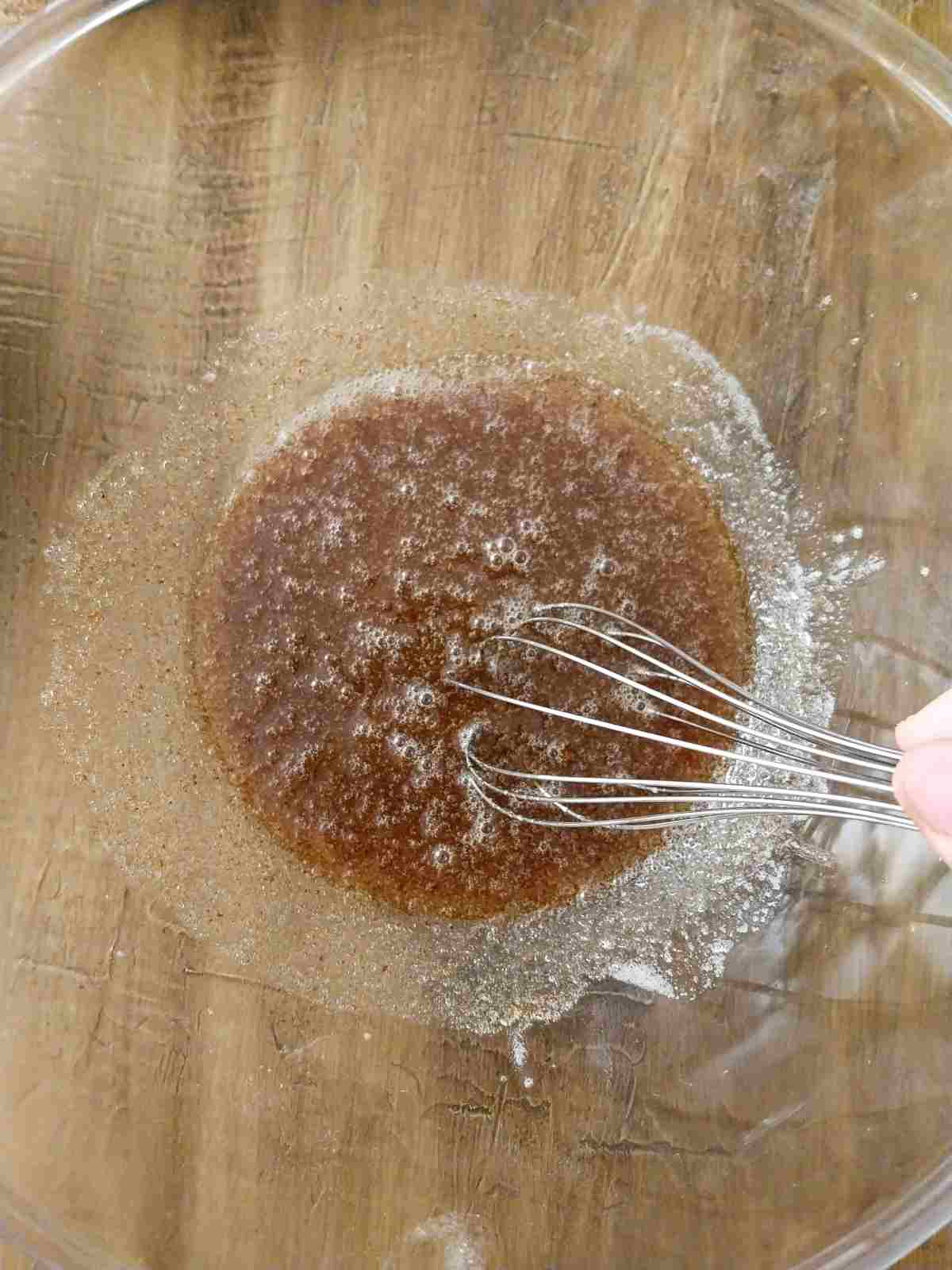 Mixing the brown butter with sugars.