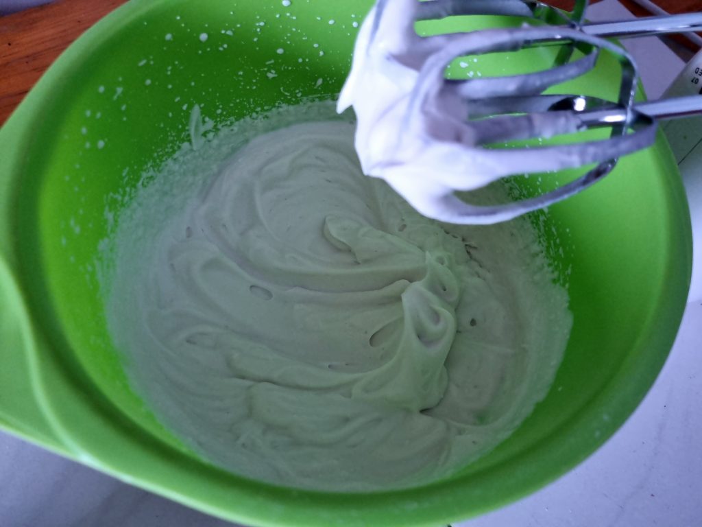 Whipping the coconut cream for the filling  of the cake