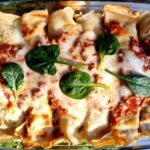 Gluten-Free Savory Crepes with mushrooms and ricotta in a glass dish.