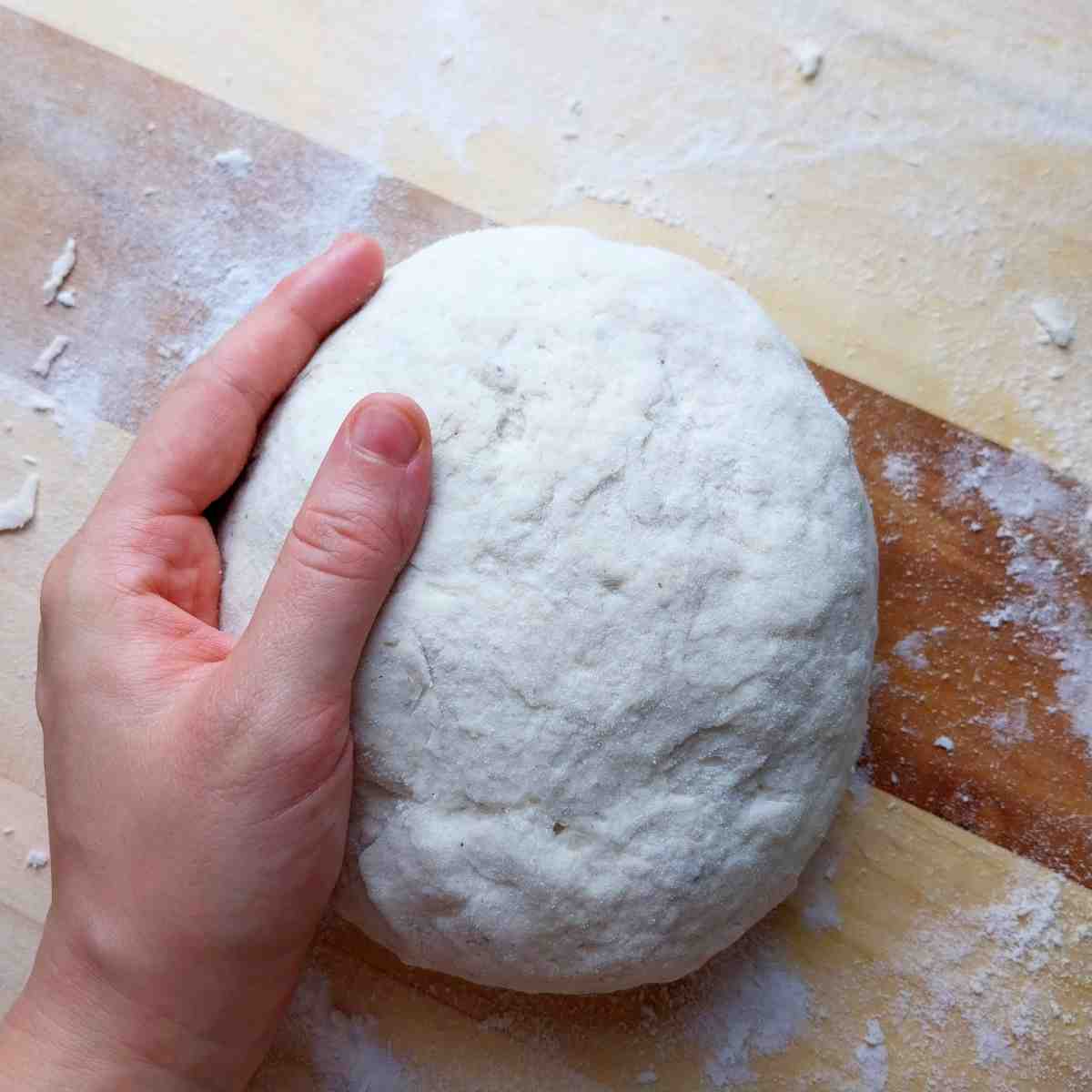Shaped dough on a wooden surface.