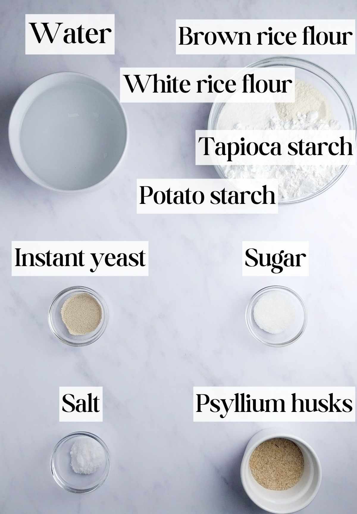 Ingredients for psyllium bread on a light surface.