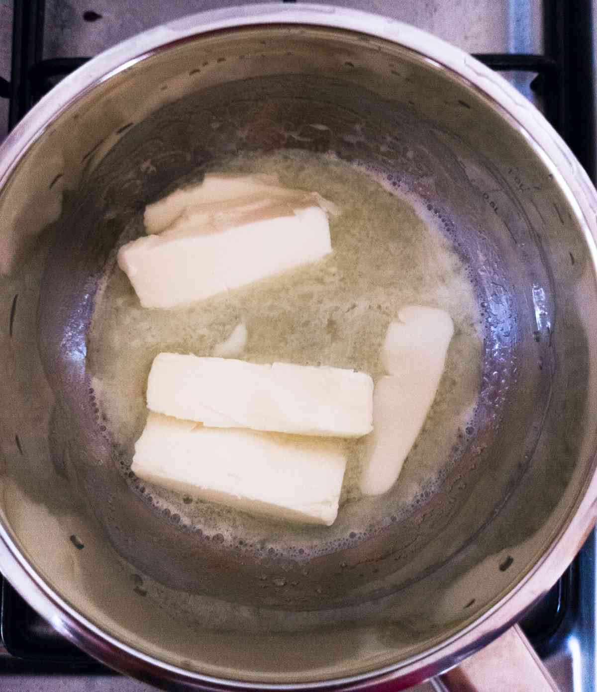 Melting butter in a small saucepan.
