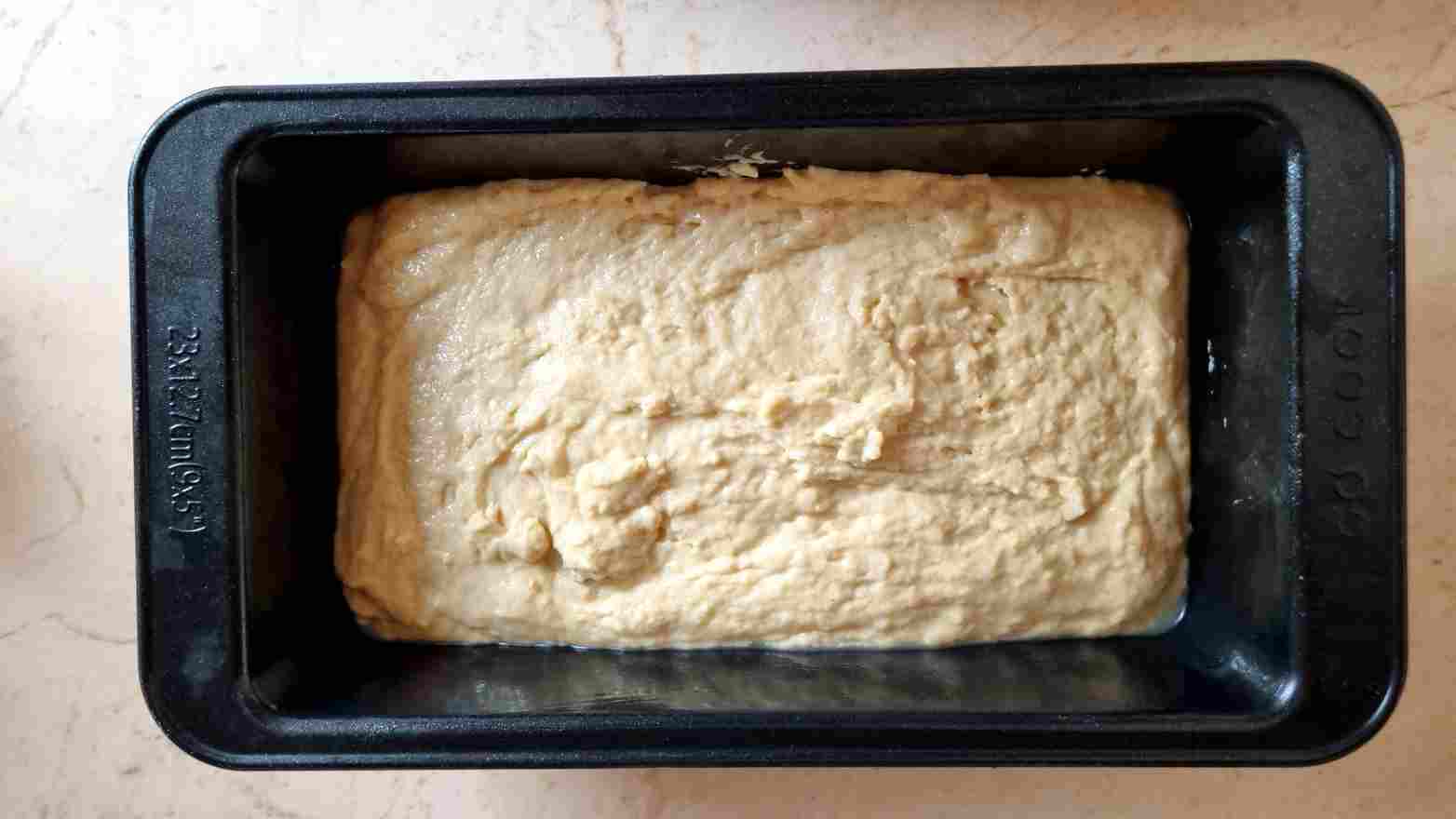 The dough in the bread pan before the rise.