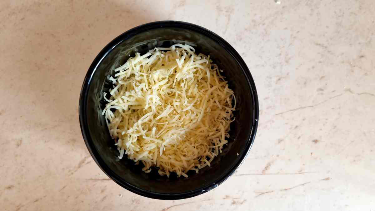 Grated Irish Cheddar CHeese in a Black Bowl
