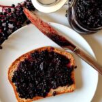 Elderberry Jam spread onto a piece of bread