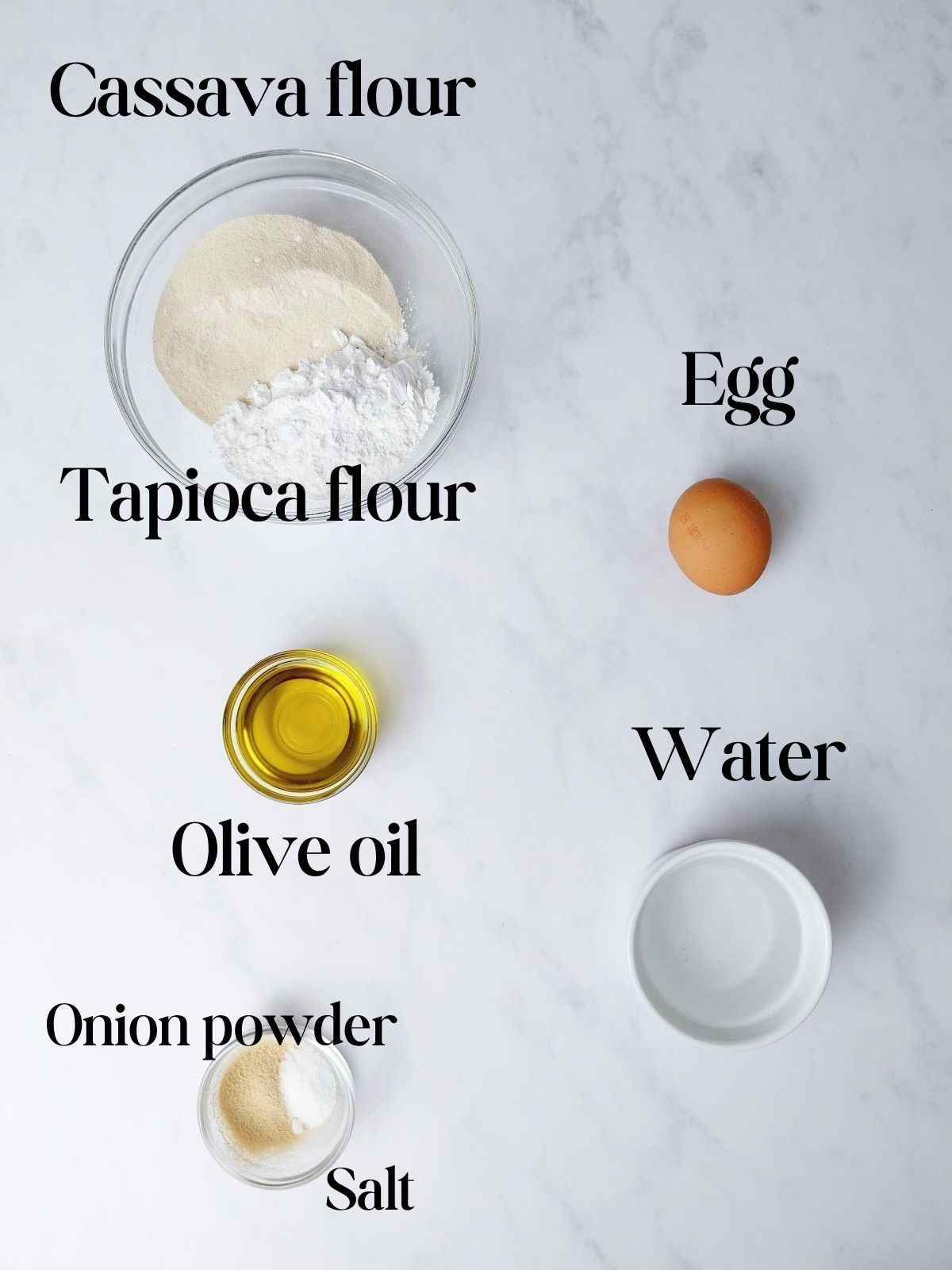 Ingredients for cassava pizza crust on a white surface.