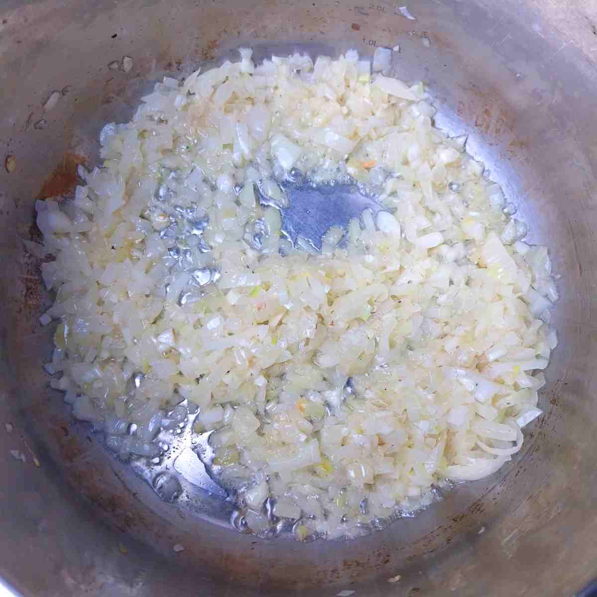 Sauteing onions in a pot.