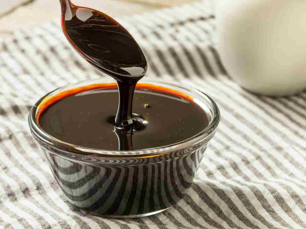 molasses in a little bowl with a spoon.