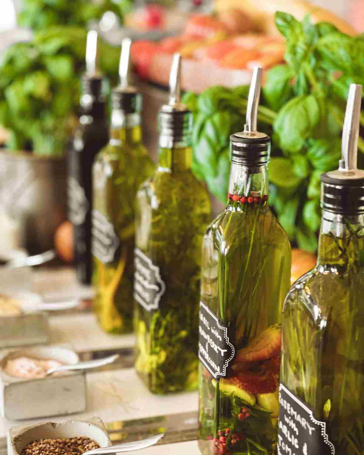 vegan oils in bottles infused with herbs.