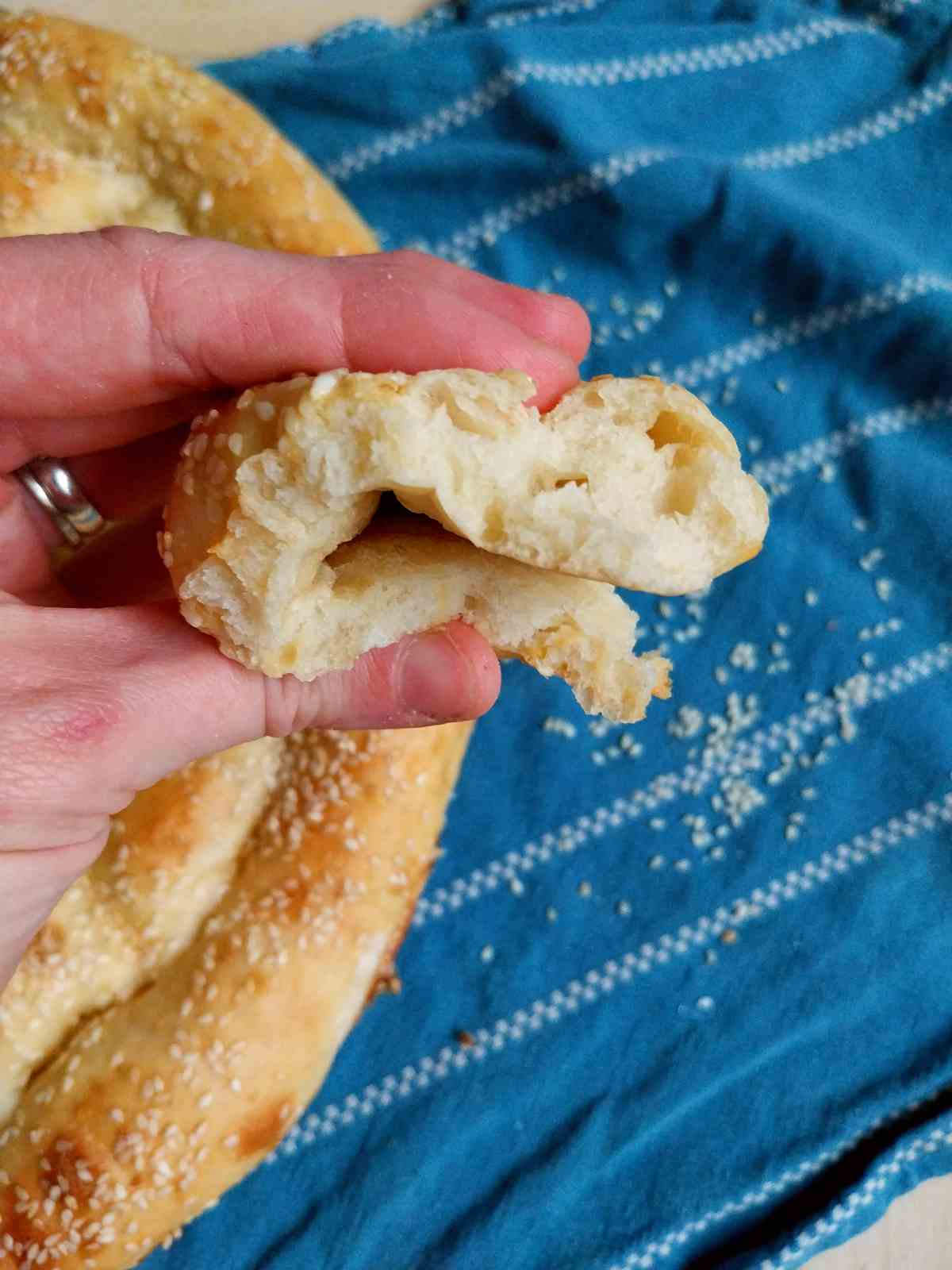 A piece of Turkish bread smooshed with a hand.