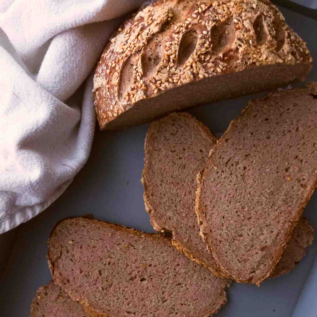 Gluten Free buckwheat sourdough sliced with half a loaf in the background.