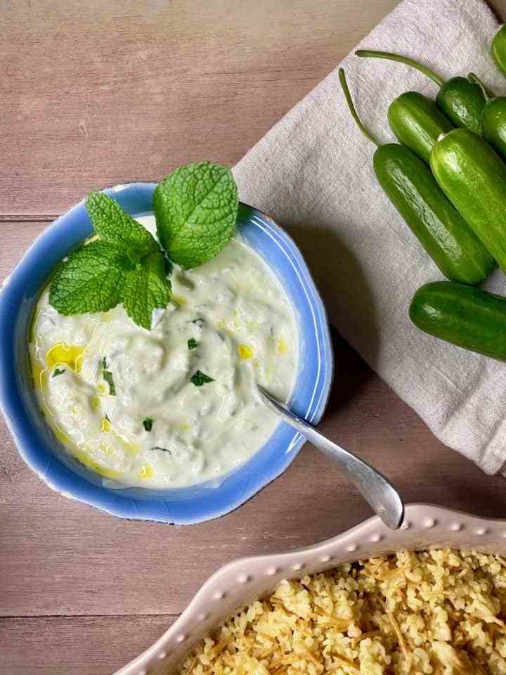 Cacik in a small bowl with mint.