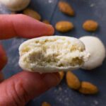 Dulce de leche macaron bit into.