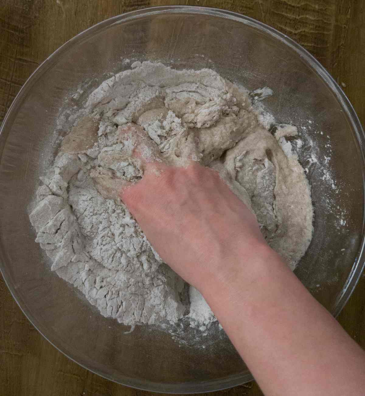Mixing the dough with a hand.