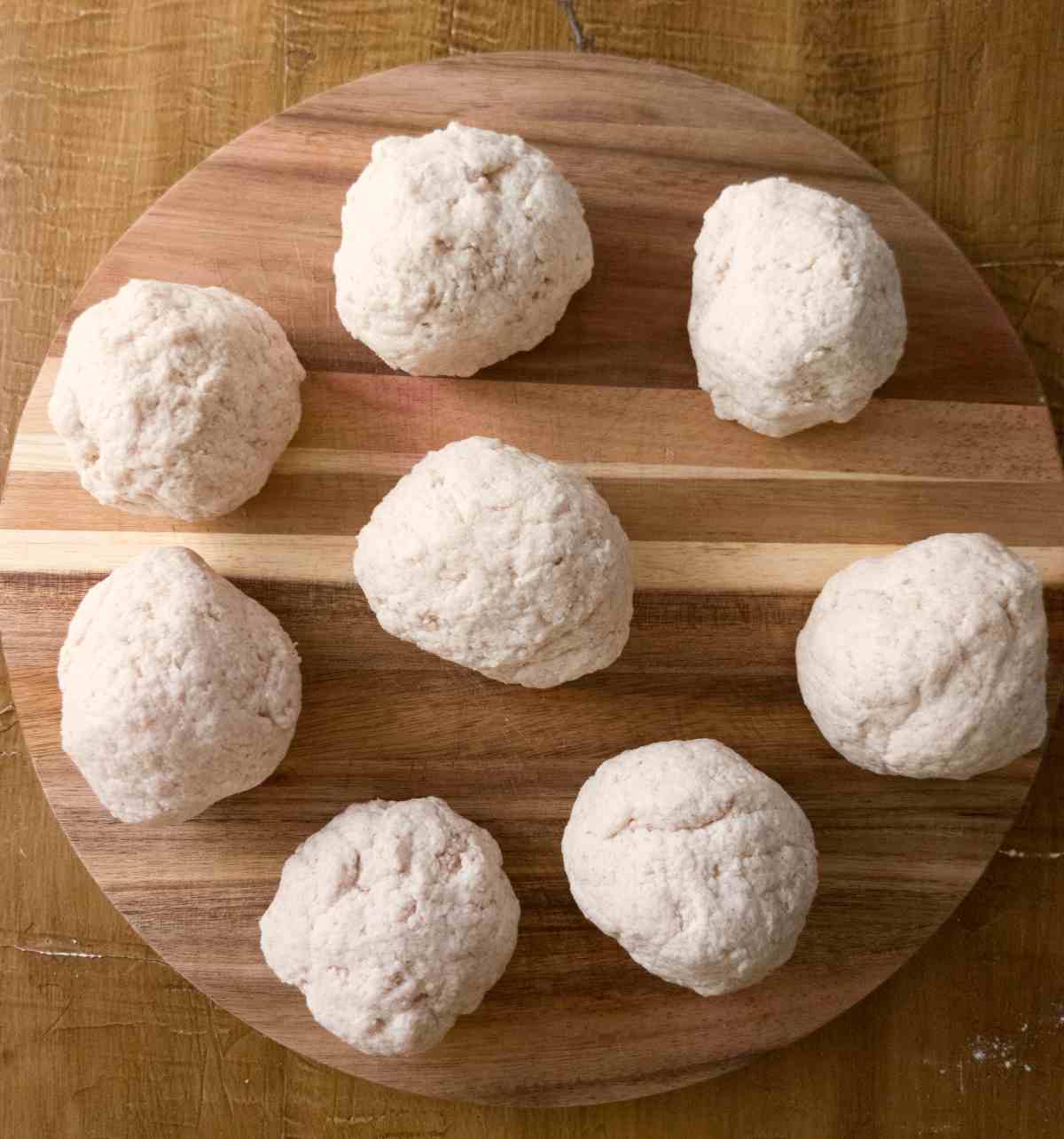 The dough pieces shaped into balls.