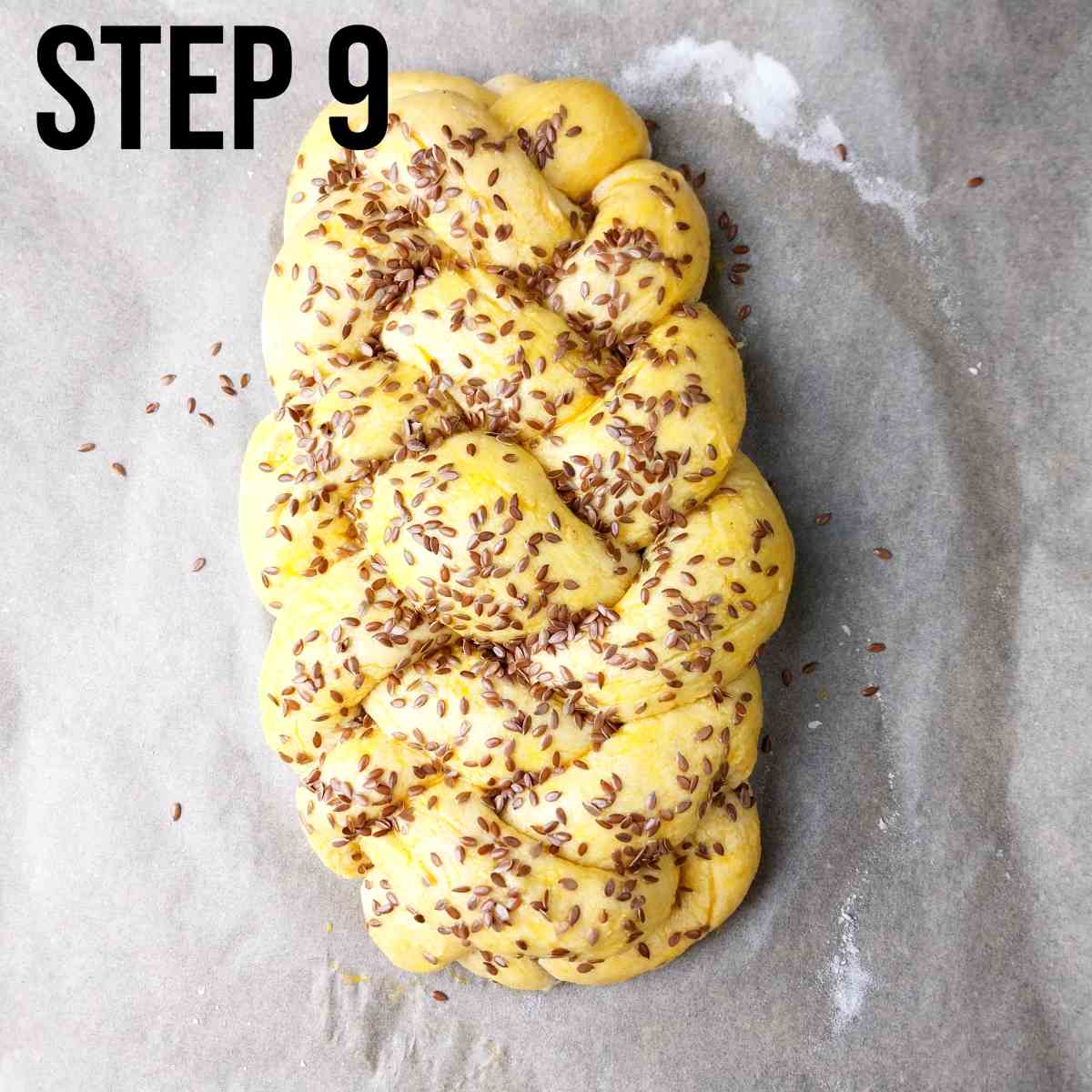 Challah after rising, egg wash, and adding the seeds.