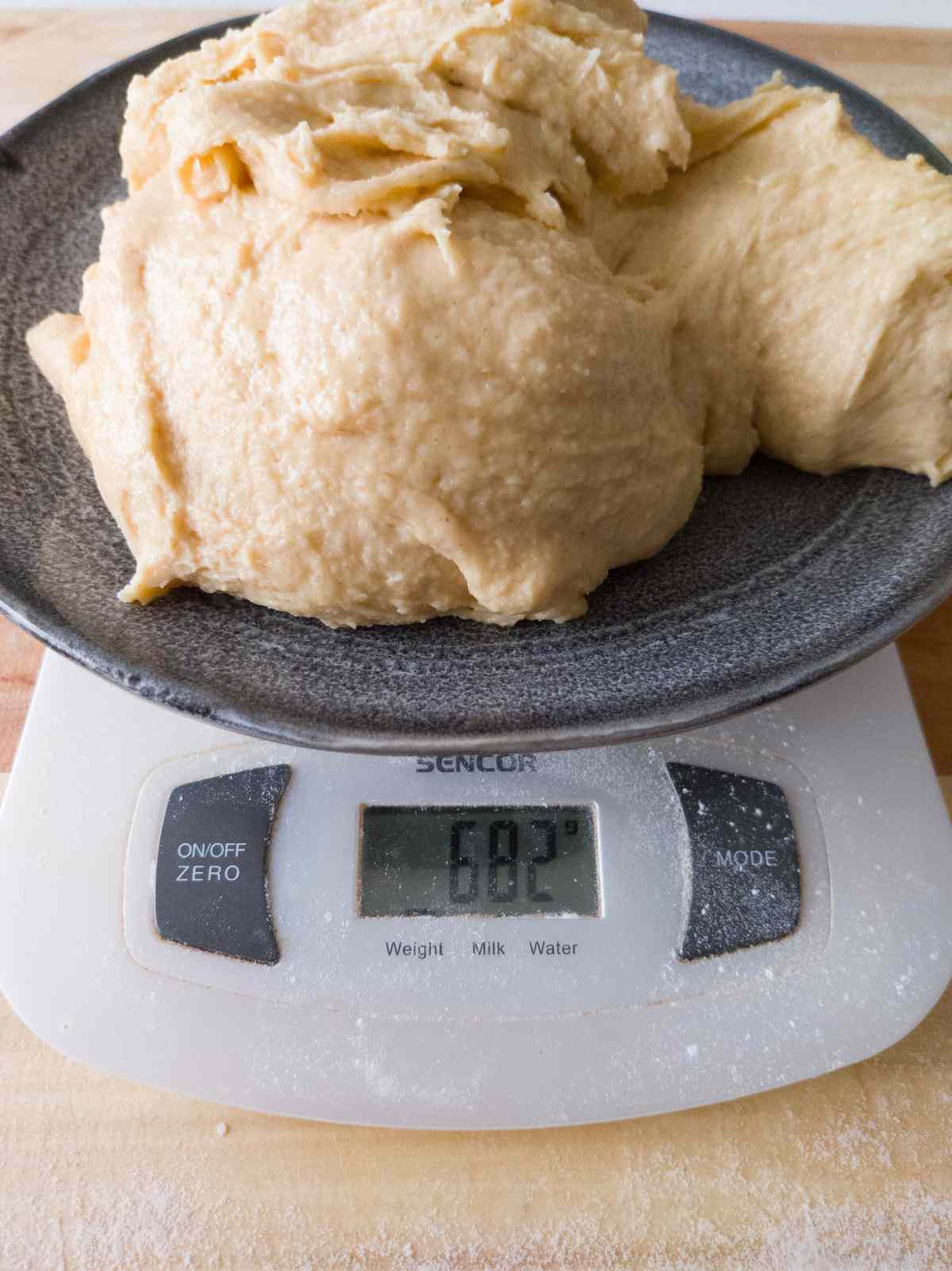 Weighing the dough on a digital scale.