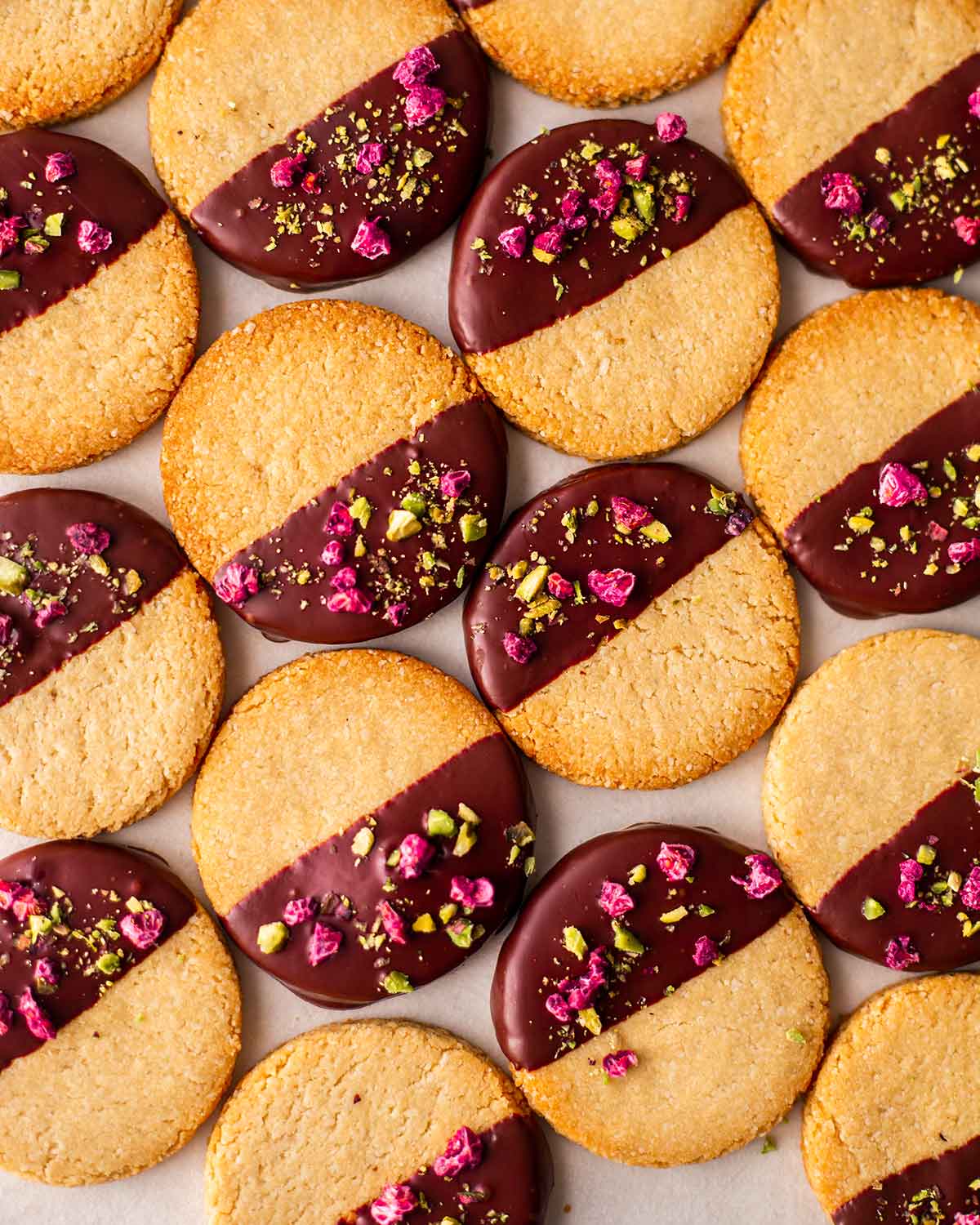 Sugar free and gluten free almond cookies next to each other on a light surface.