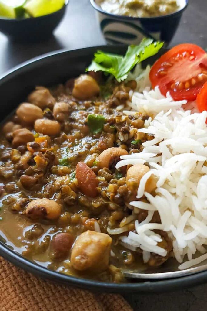 Indian mixed beans curry in a bowl with rice. 