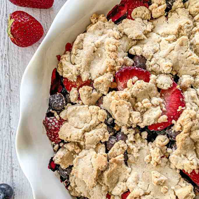 Mixed Berry Cobbler in a white dish.