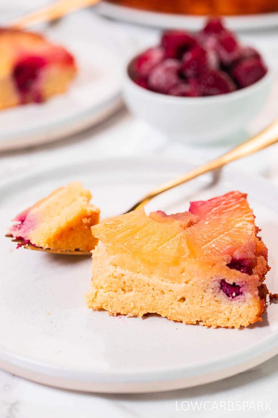 Pineapple upside down cake on a white plate.