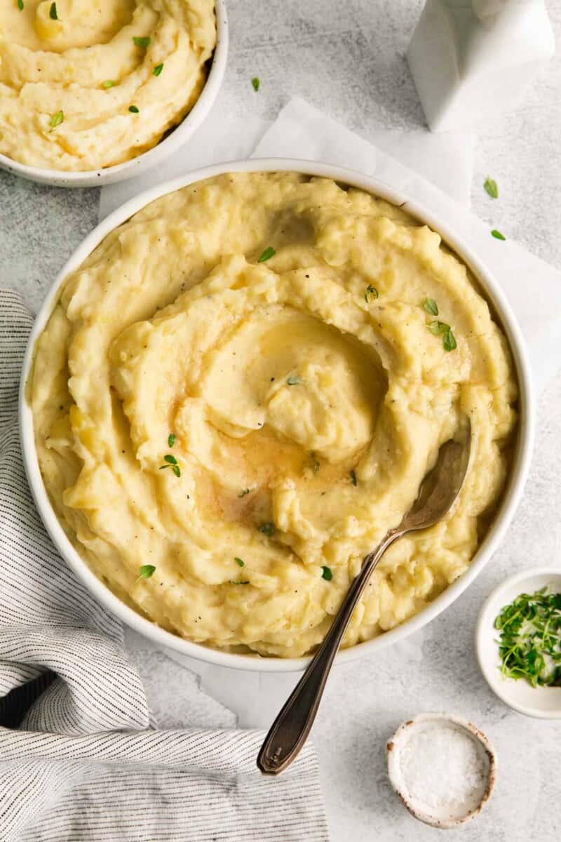 Dairy free mashed potatoes in a large bowl with a spoon. 