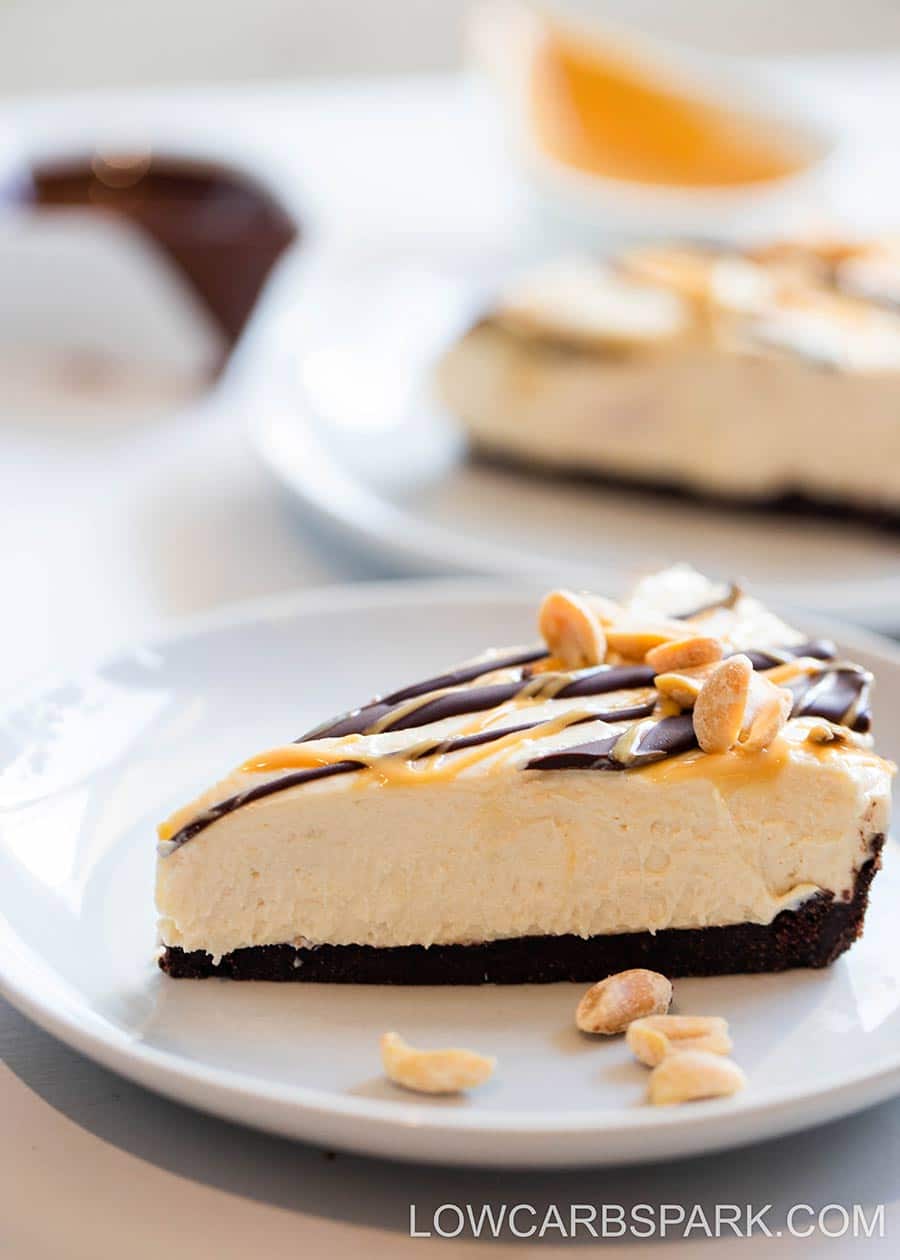 No Bake peanut butter pie on a white plate with the rest of the pie in the background.
