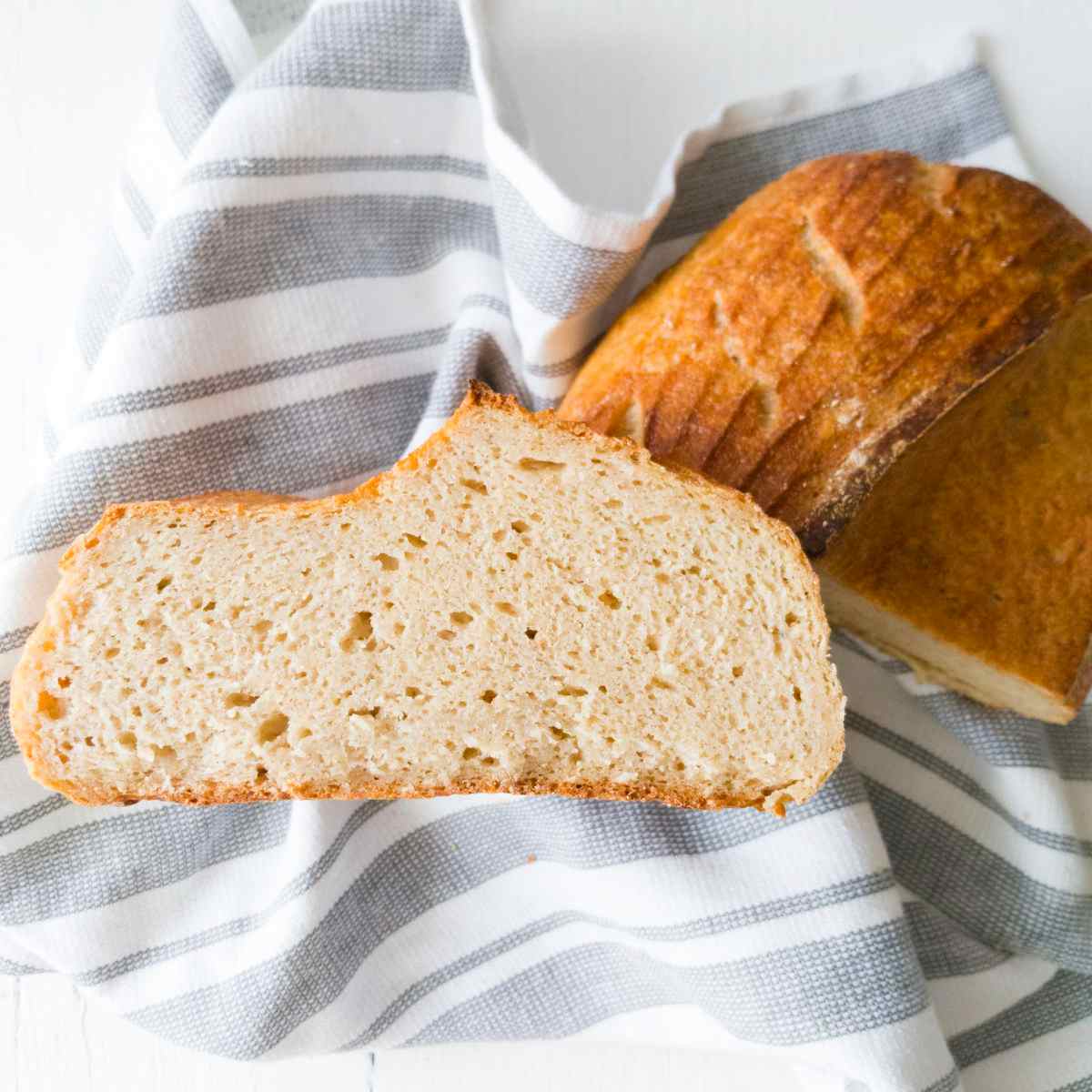 Gluten-free sourdough bread cut in half.