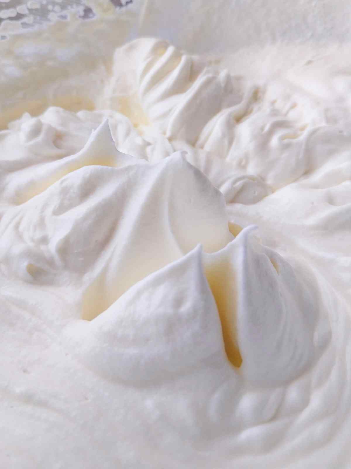 Stiff peaks in the whipping cream.