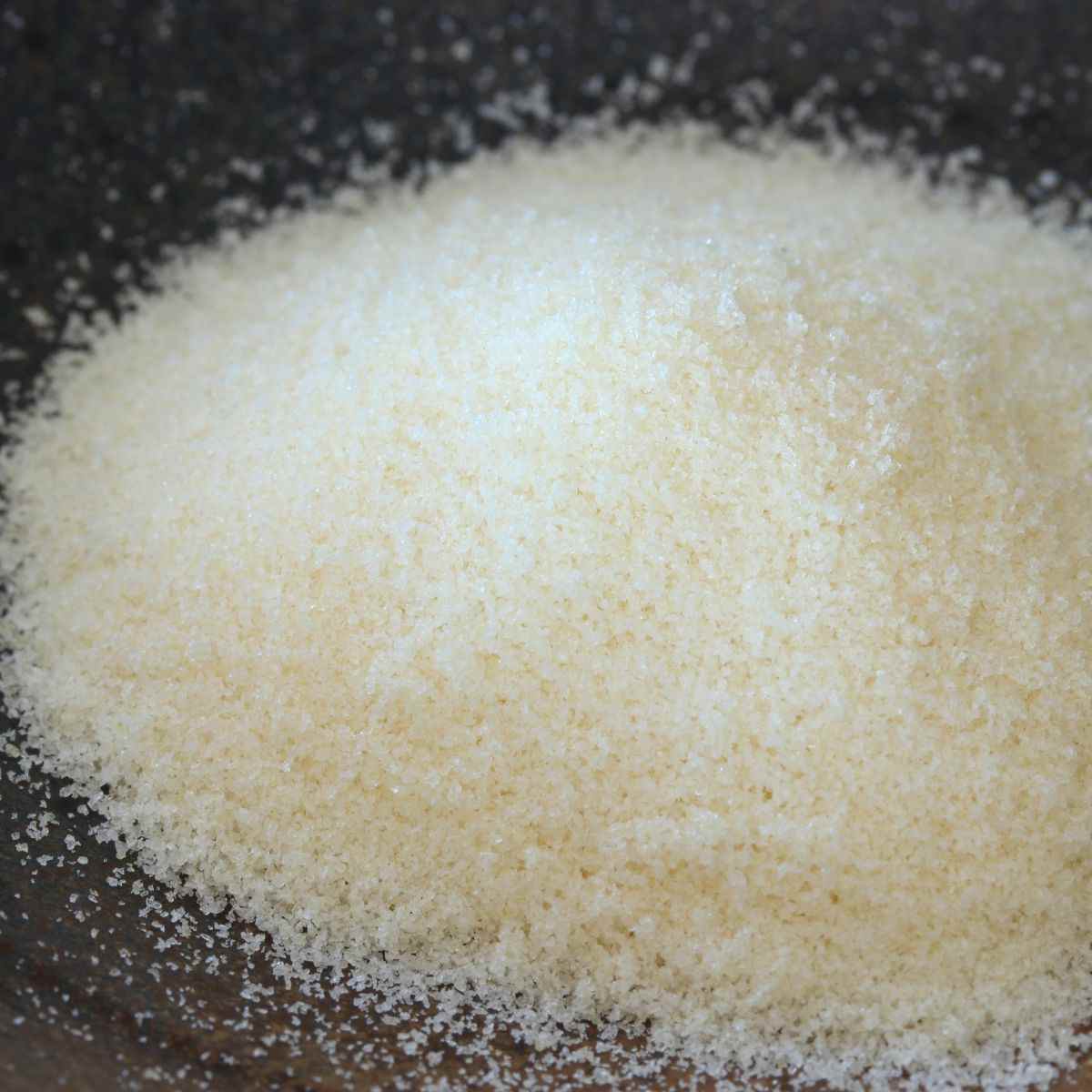 Gelatin powder on a wooden surface.