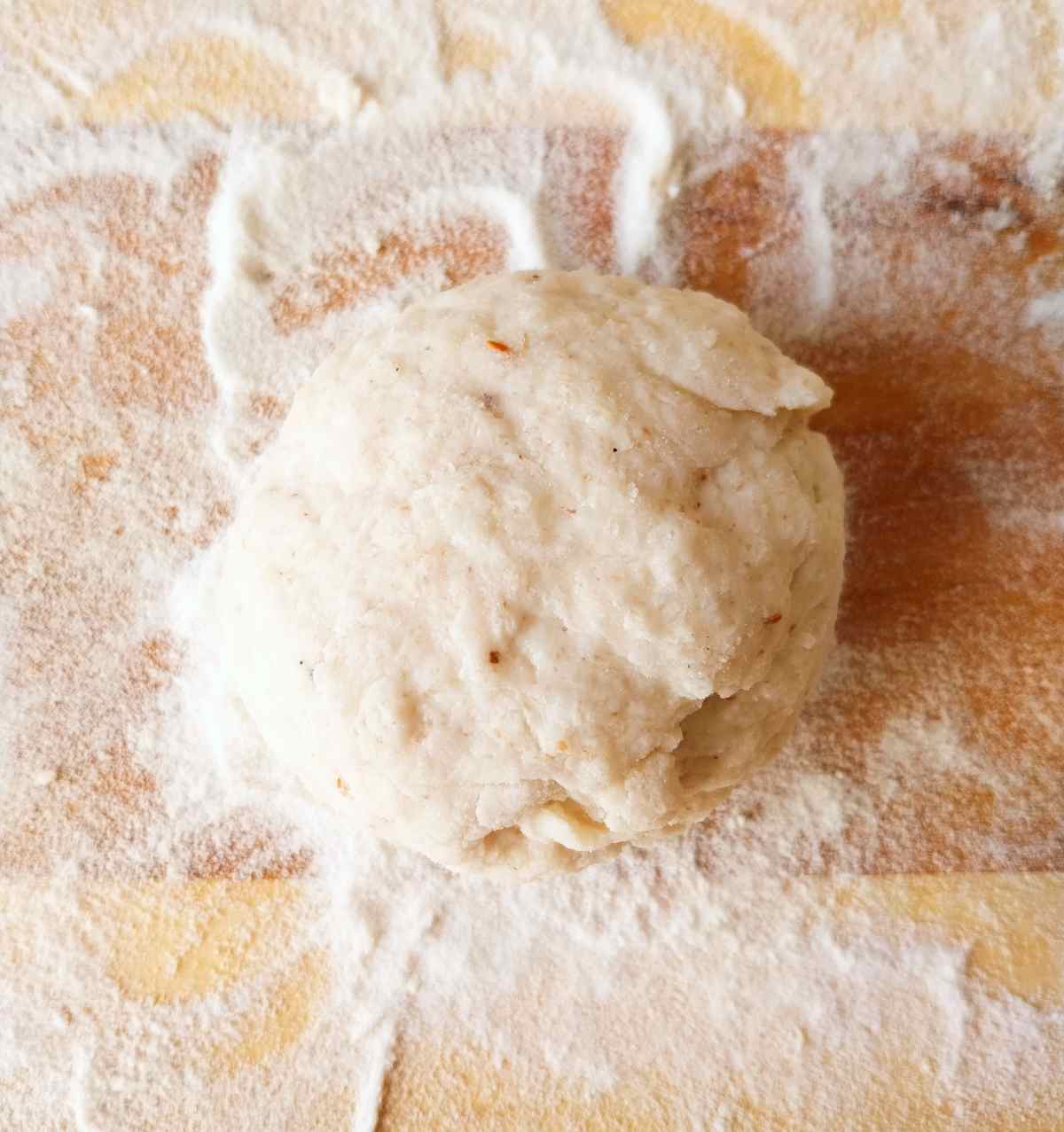 A piece of dough shaped into a ball.