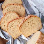 Millet bread sliced and arranged on a kitchen towel.