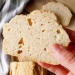 A slice of rice flour bread with air pocket visible.