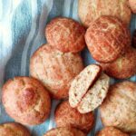 Gluten-Free Sourdough Snickerdoodles on a kitchen towel.