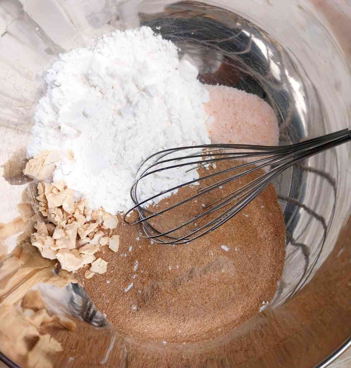 Mixing ingredients with a whisk.