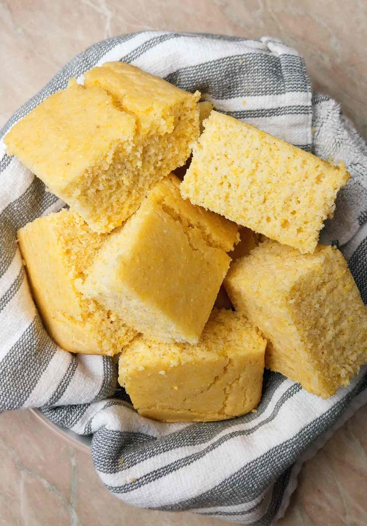 Cut up cornbread in a kitchen towel.