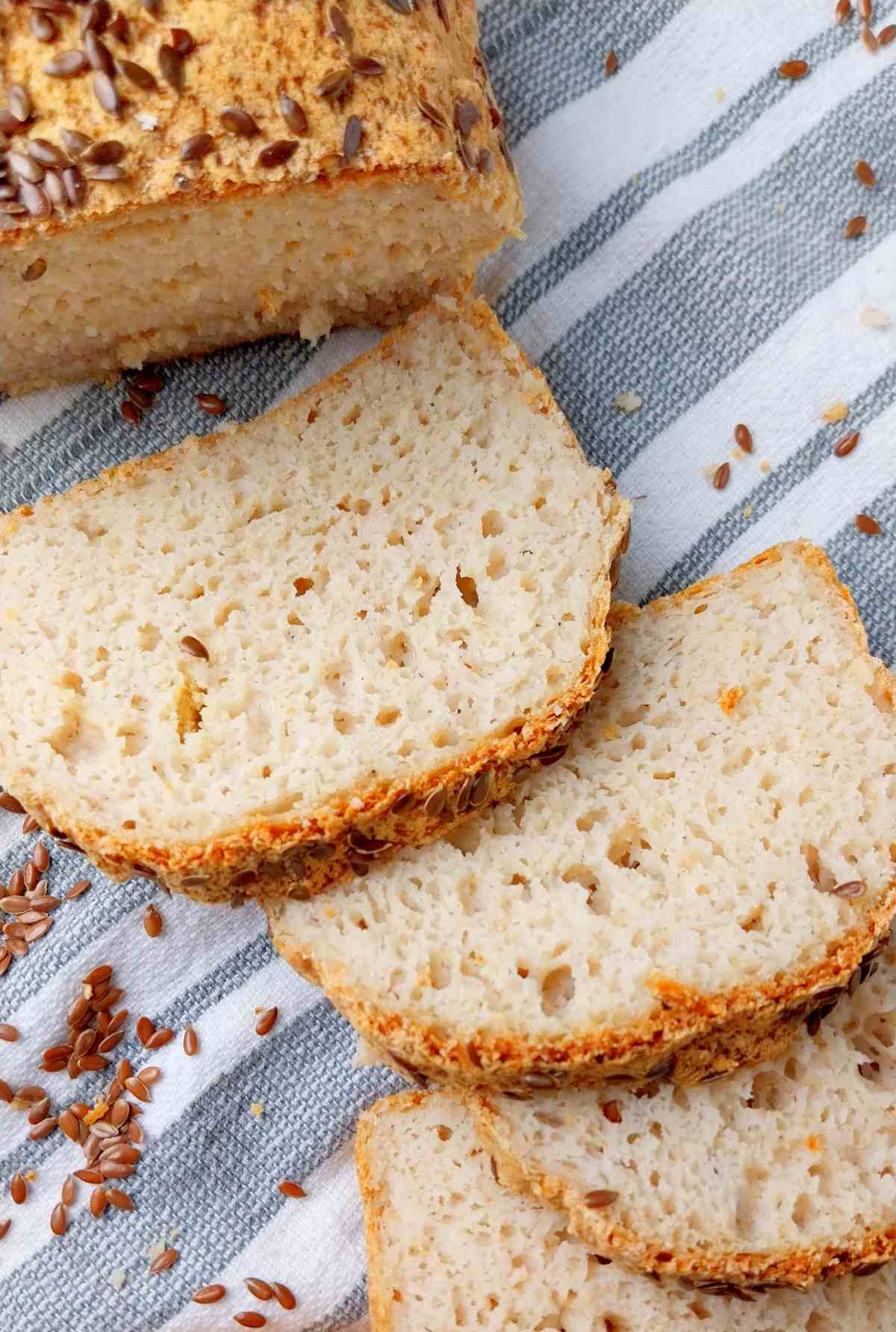 Brown rice bread slices on a kitchen towel.