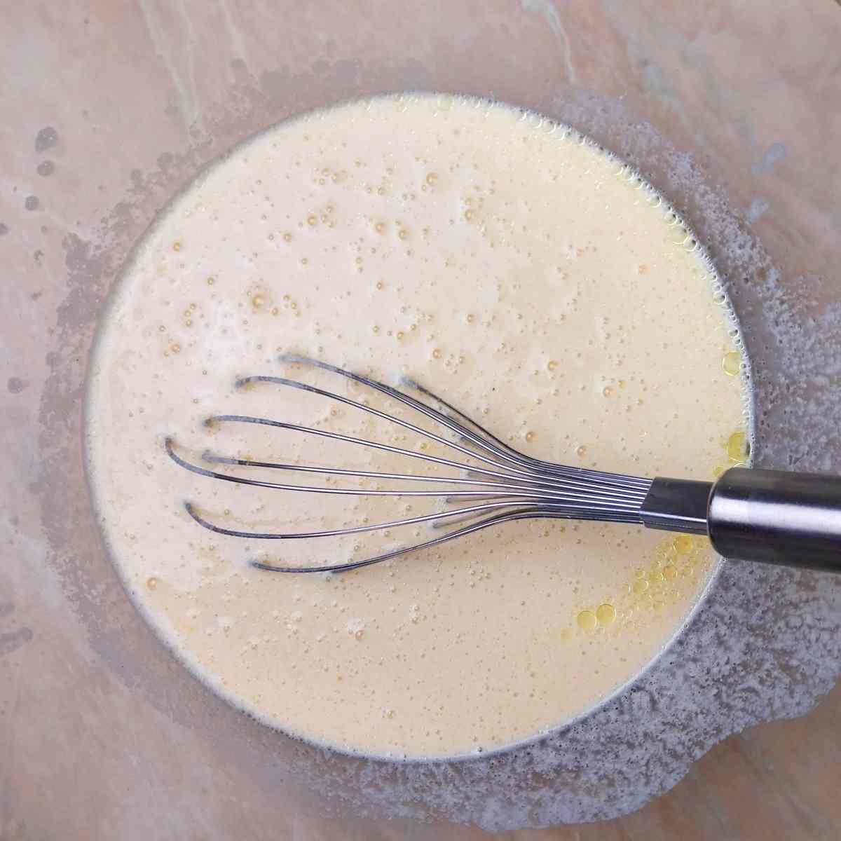 Liquid ingredients mixed in a bowl.