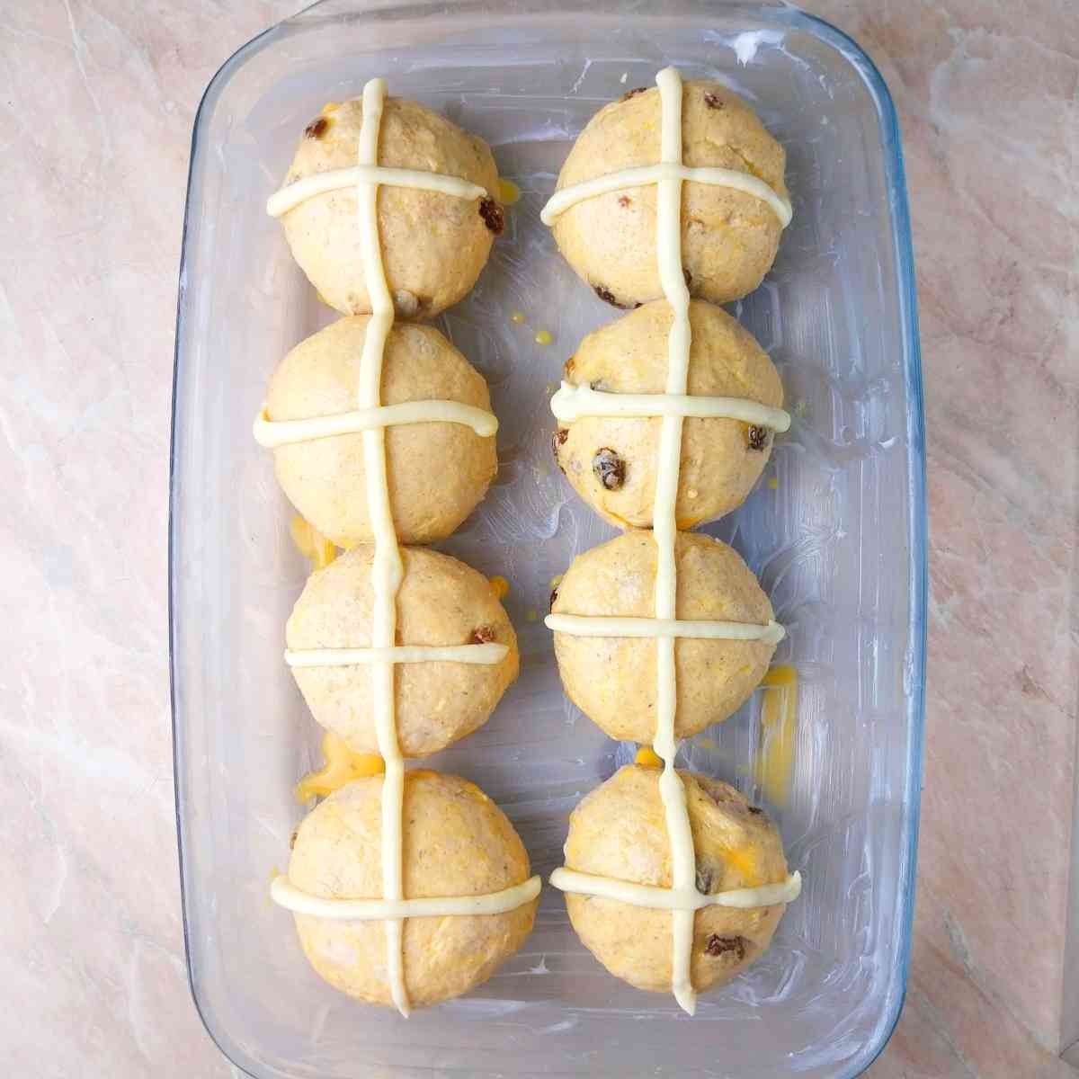 Egg washed hot cross buns with the crosses on.