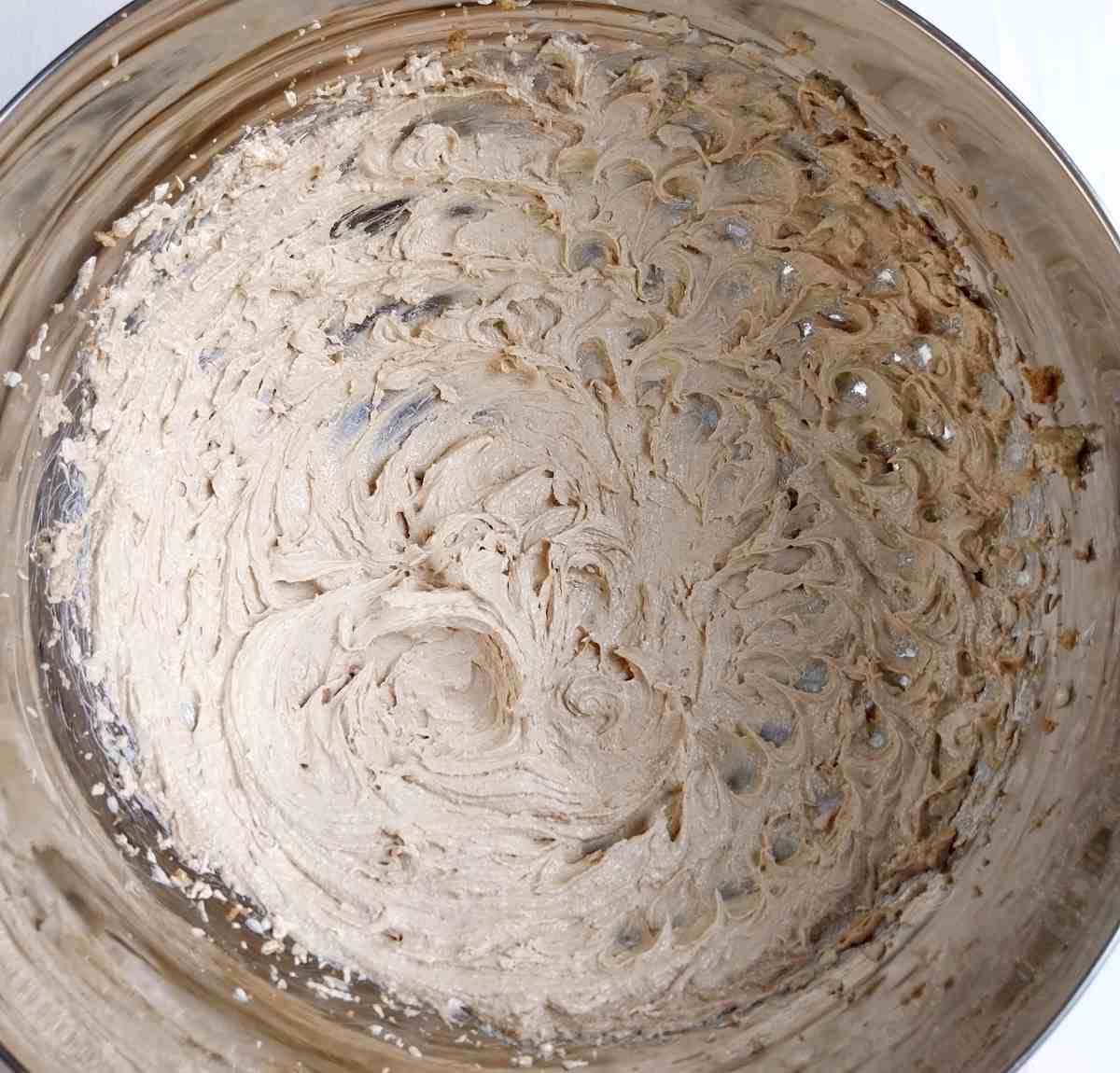 A mixing bowl with beaten butter and sugar.