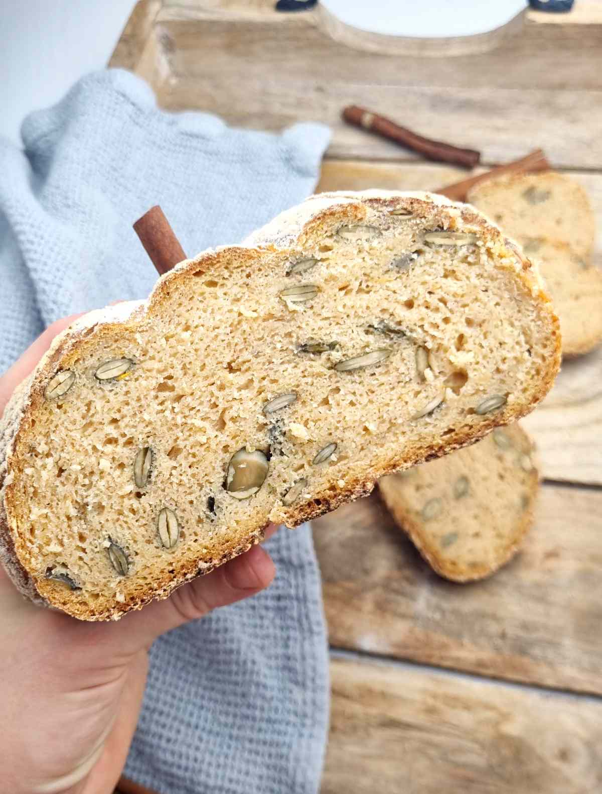 Sliced in half pumpkin sourodugh with toasted seeds inside.