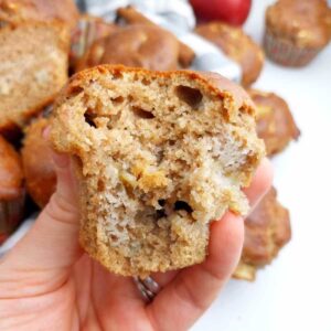 A buckwheat apple muffin held by a hand.