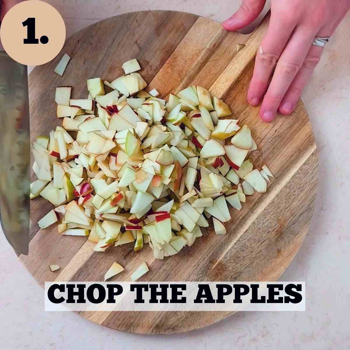 Chopped apples on a wooden cutting board.