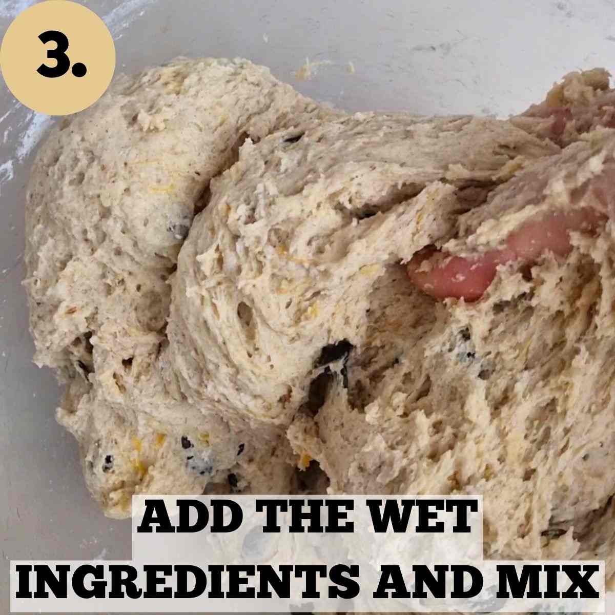 The dough in a glass mixing bowl.
